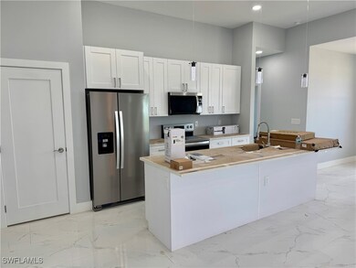 Kitchen featuring stainless steel appliances, ligh