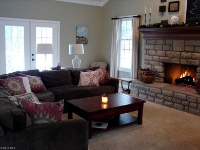 family room with gas fireplace and French doors to