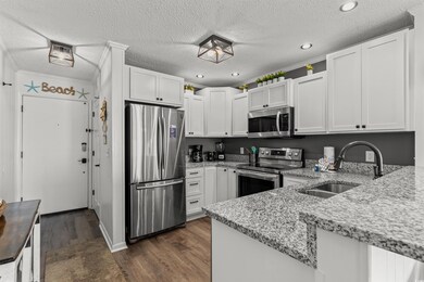 Kitchen with appliances with stainless steel finis