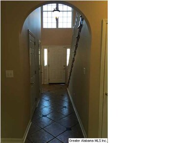 Looking back at the grand foyer with vaulted ceili