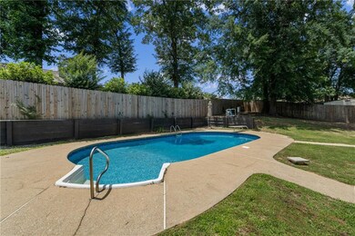 View of pool with a patio and a diving board