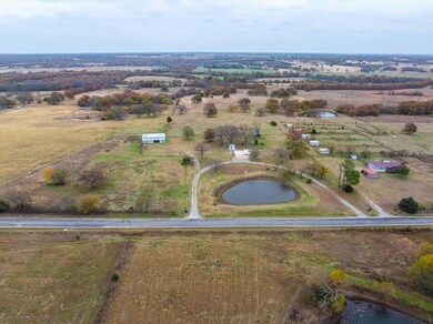 Drone / aerial view featuring a water view and a rural view