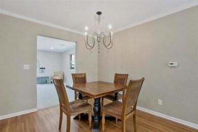 Dining is open to kitchen and living room.