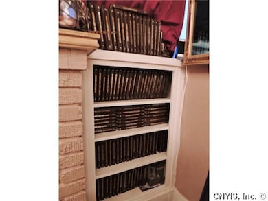 Living Room. Built-ins on either side of fireplace.