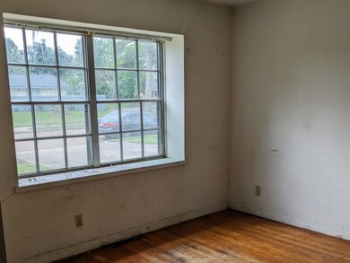 Living area is to the left of entry. Lots of light