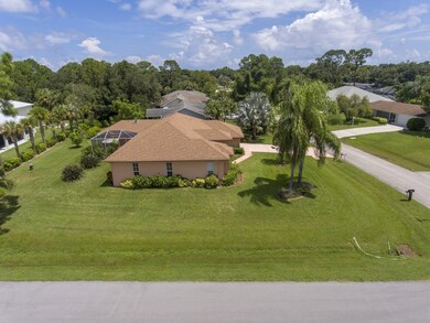 Aerial view of home and large property.