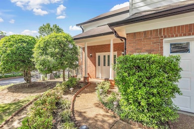 Property entrance with brick siding and roof with 