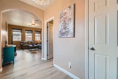 Entry Corridor with arched walkways, light wood-ty