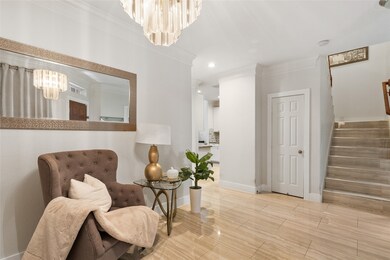The entryway and dining area are elegant and sleek