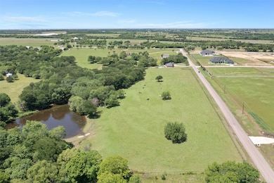 Aerial view of sparsely populated area with a large body of water