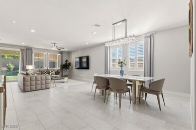 Spacious living room with recessed lighting and large windows.