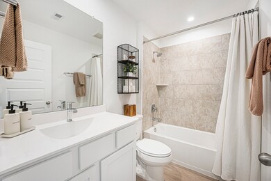 Full secondary bathroom located at the front of th