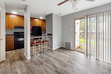 Kitchen featuring range, ,cabinetry, LVP floors, b