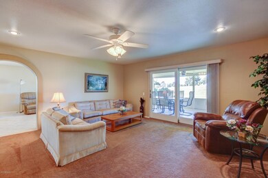 LIVING ROOM W/DOOR TO PATIO