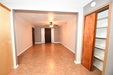 View of entrance from kitchen. Pantry shown on the right.