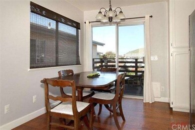 The dining area and kitchen also have maple floors