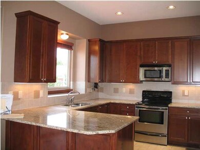 Large modern kitchen with beautiful upgraded cherr