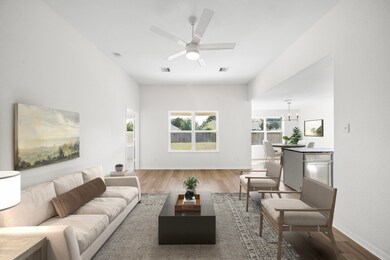 Central living room with high ceiling and open sight lines throughout the common areas.  (Virtually staged.)