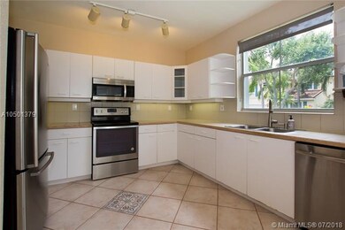 LARGE KITCHEN WITH STAINLESS STEEL APPLIANCES