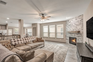 A view of the fireplace and the windows that let i