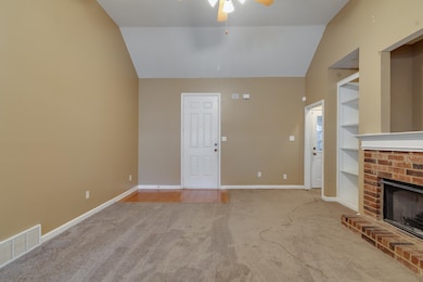 Unfurnished living room with visible vents, built 