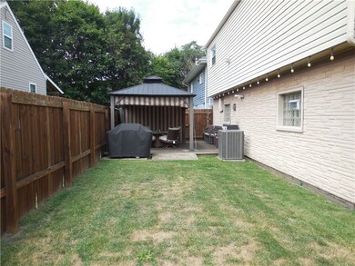Another view of yard and pergola.