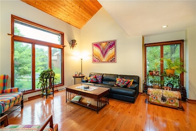 Cathedral ceilings floor to ceiling windows and ha