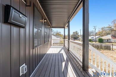 Wooden porch featuring a residential view