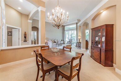 Dining area with recessed and designer lighting.