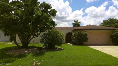 View of front of property featuring a front yard a