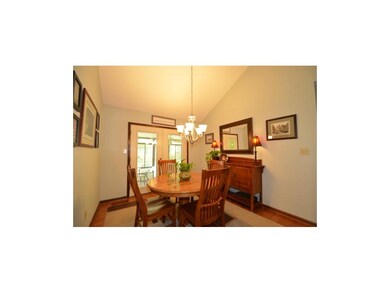 Dining room w/ French doors leading to sunroom.