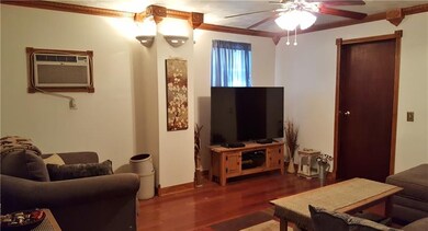 Cherry Wood floors, Sconce lighting, and Gorgeous 