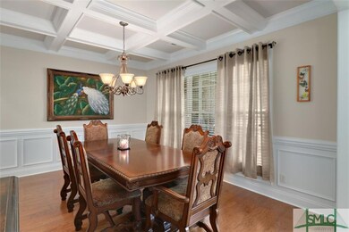 Formal dining room with coffered ceiling and detai
