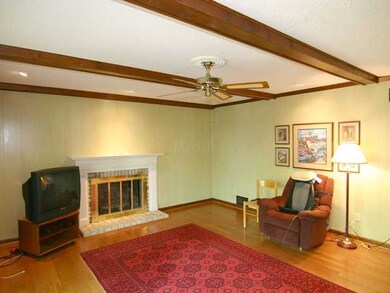 Den with built in book cases & wood burning firepl