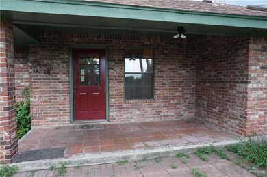 View of exterior entry featuring ceiling fan