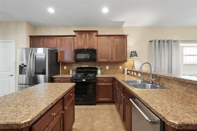 The kitchen is nice and spacious with lots of cabi