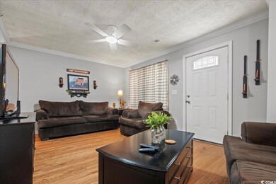 Living room with light wood finished floors, a tex