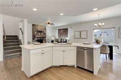 Kitchen with stainless steel dishwasher, open floo