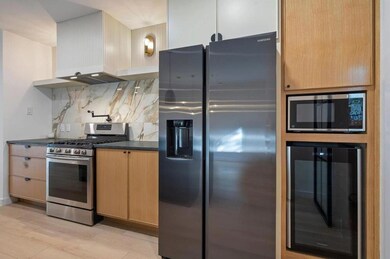 Kitchen featuring stainless steel appliances, dar