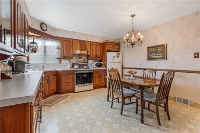 lNeutral countertops with vinyl flooring, chair ra