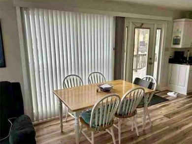 Dining space with wood finished floors