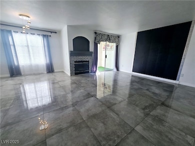 Unfurnished living room with a tile fireplace and
