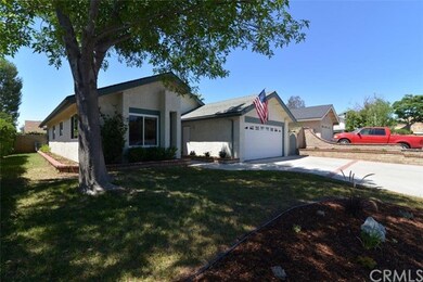 Front elevation showing side yard & planting area