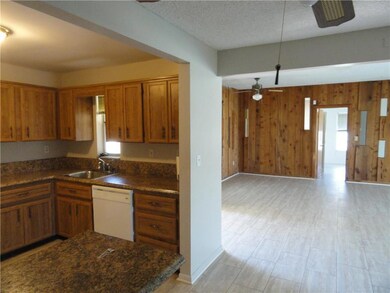 View of Kitchen and dining area. Door open to mast