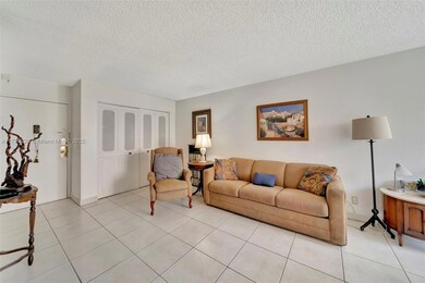 Living room with wall closet for storage
