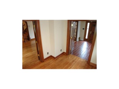 Also adjacent to the living room and sunroom is th