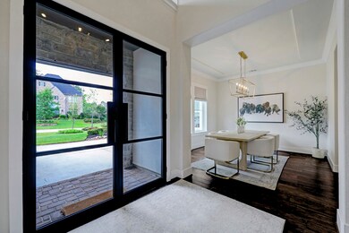 New, custom steel and glass front doors allow natu