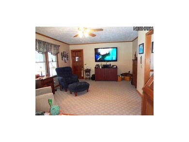 The living room has ample room to sit and read or 