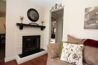 Wood burning fireplace adds charm to the family ro