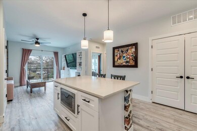 Kitchen featuring light wood-style floors, decora